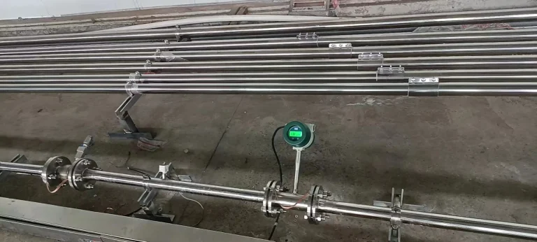 Flanged powder flow meter on a stainless steel pneumatic conveying line
