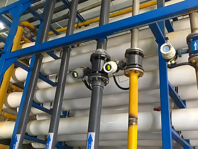 magnetic flow meters installed on vertical lines in a water treatment skid