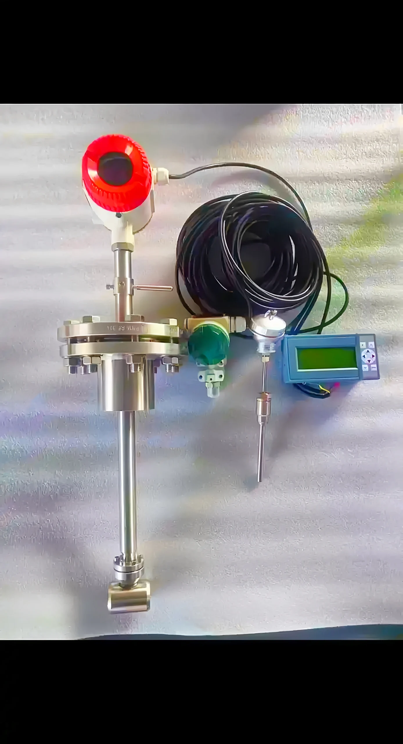 Insertion vortex flowmeter with temperature and pressure compensation